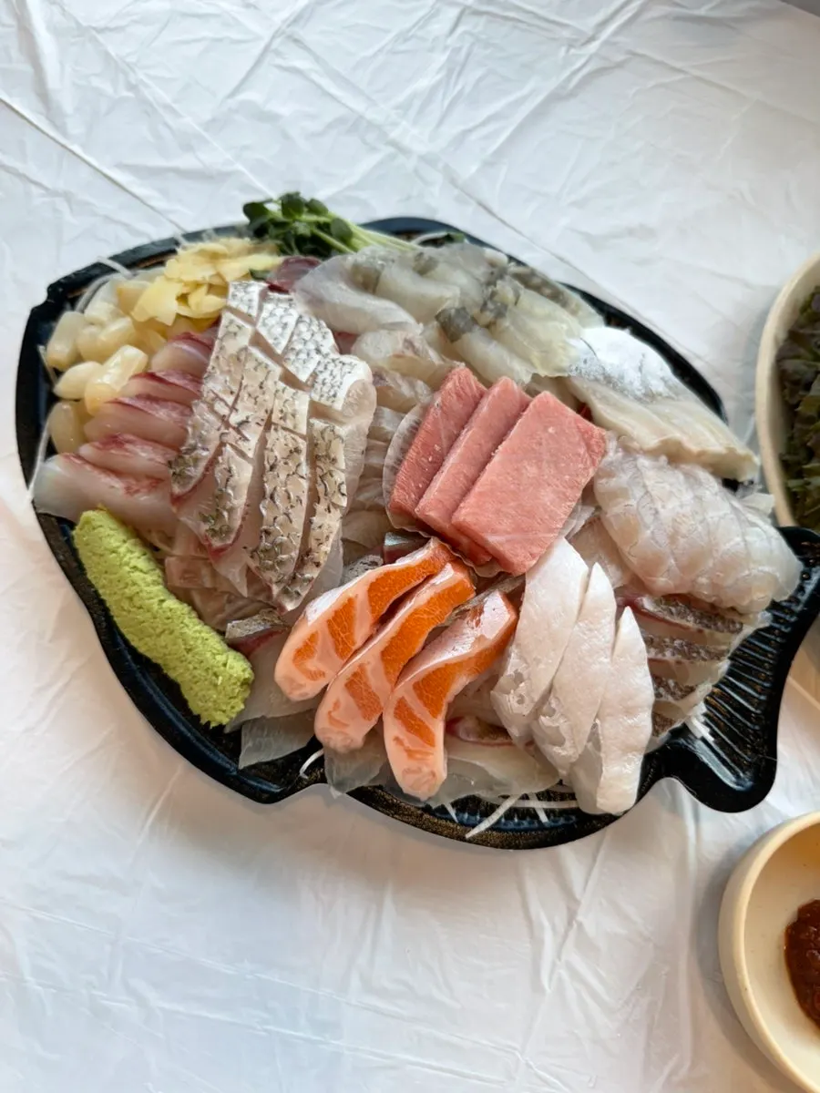 A generously loaded sashimi plate for two people