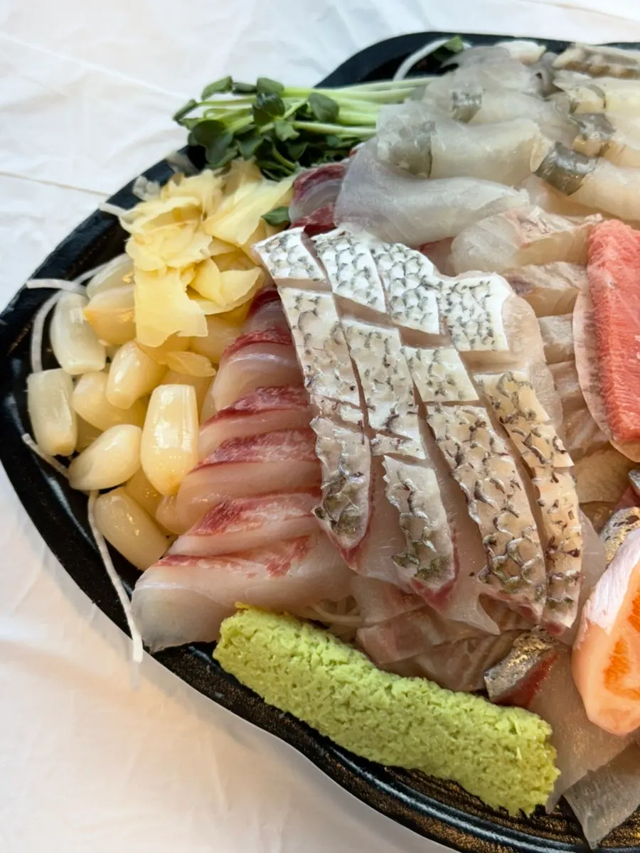 Table setting with assorted sashimi at the dipping-sauce restaurant