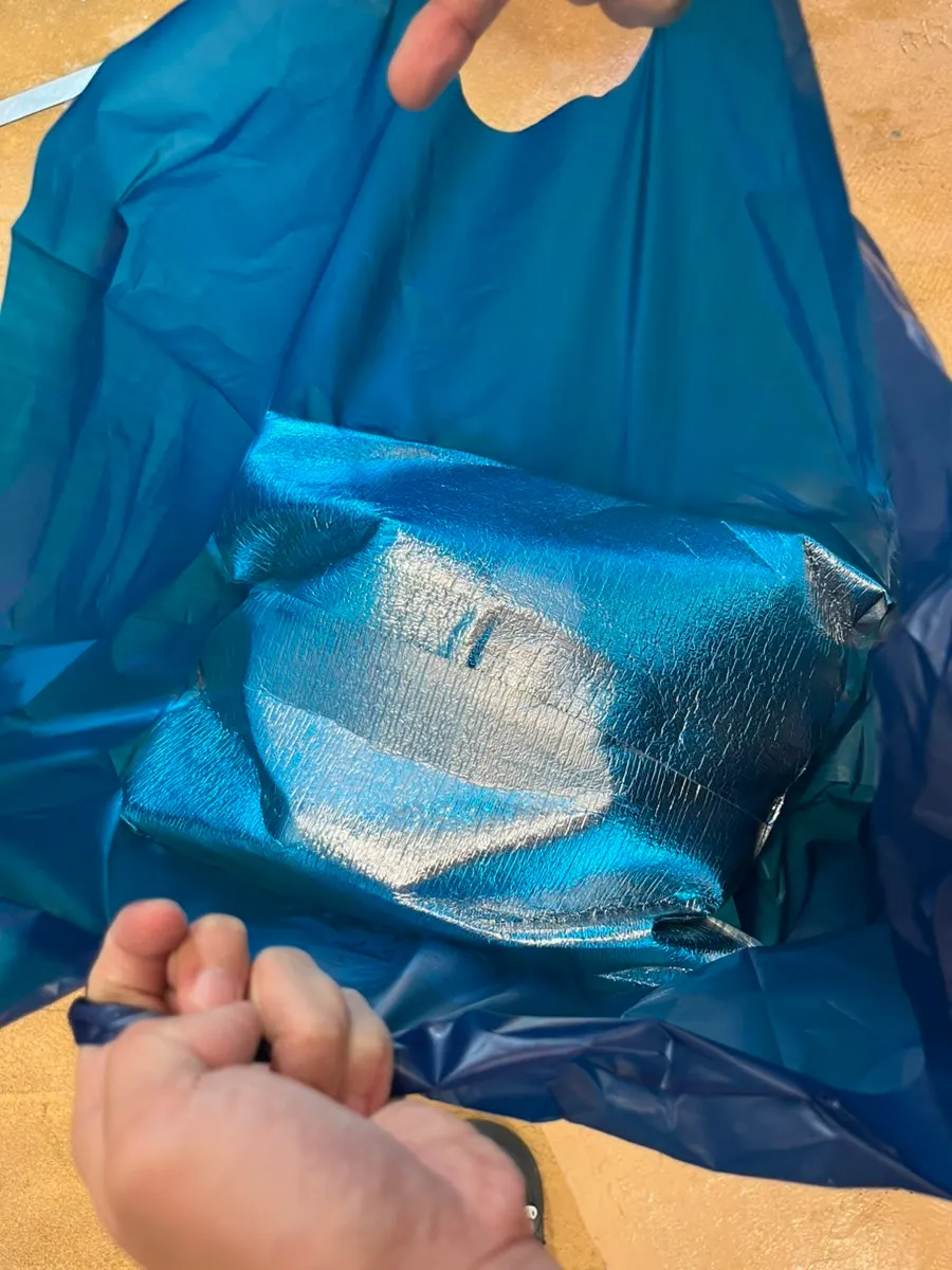 Packaging shown with the included ice pack