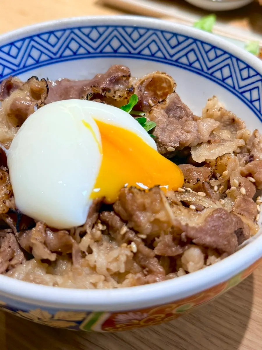 Close-up of the poached egg on top of the gyudon