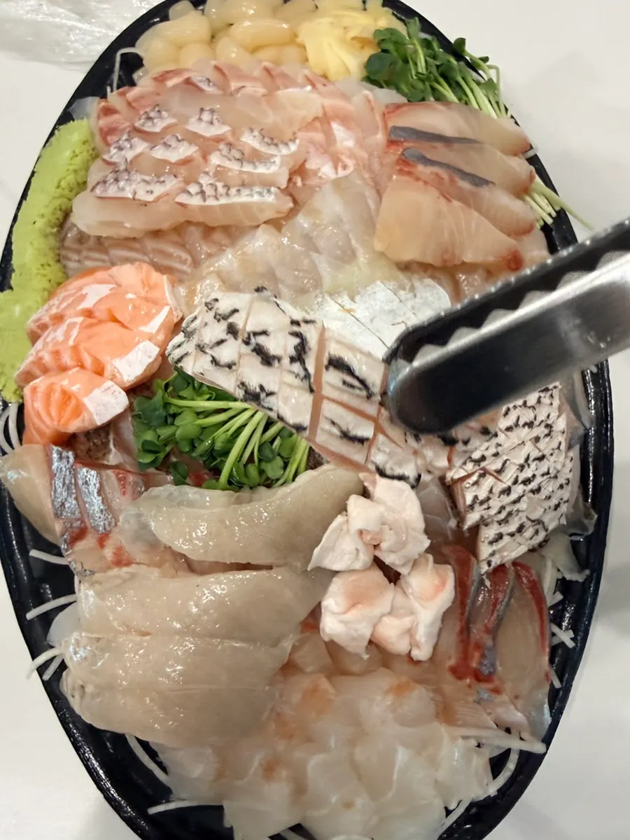 Assorted sashimi takeaway for a housewarming