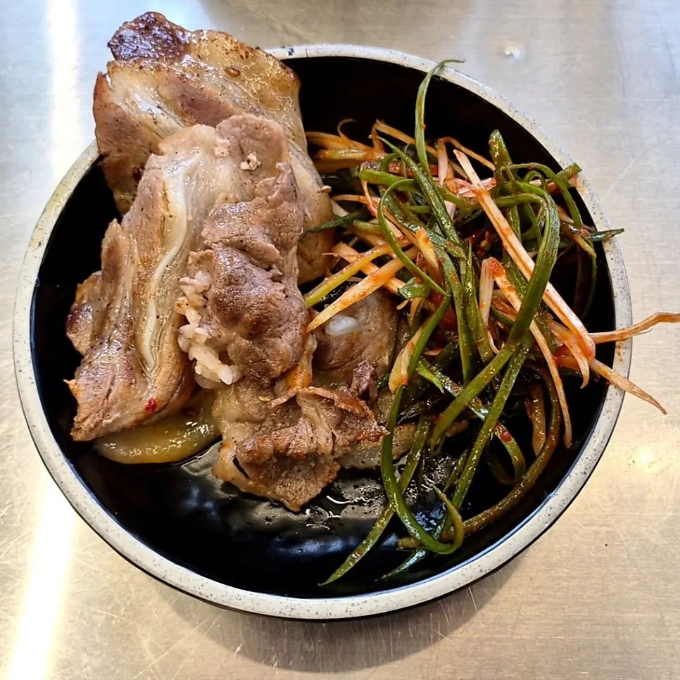 Gochujang pork belly served over rice
