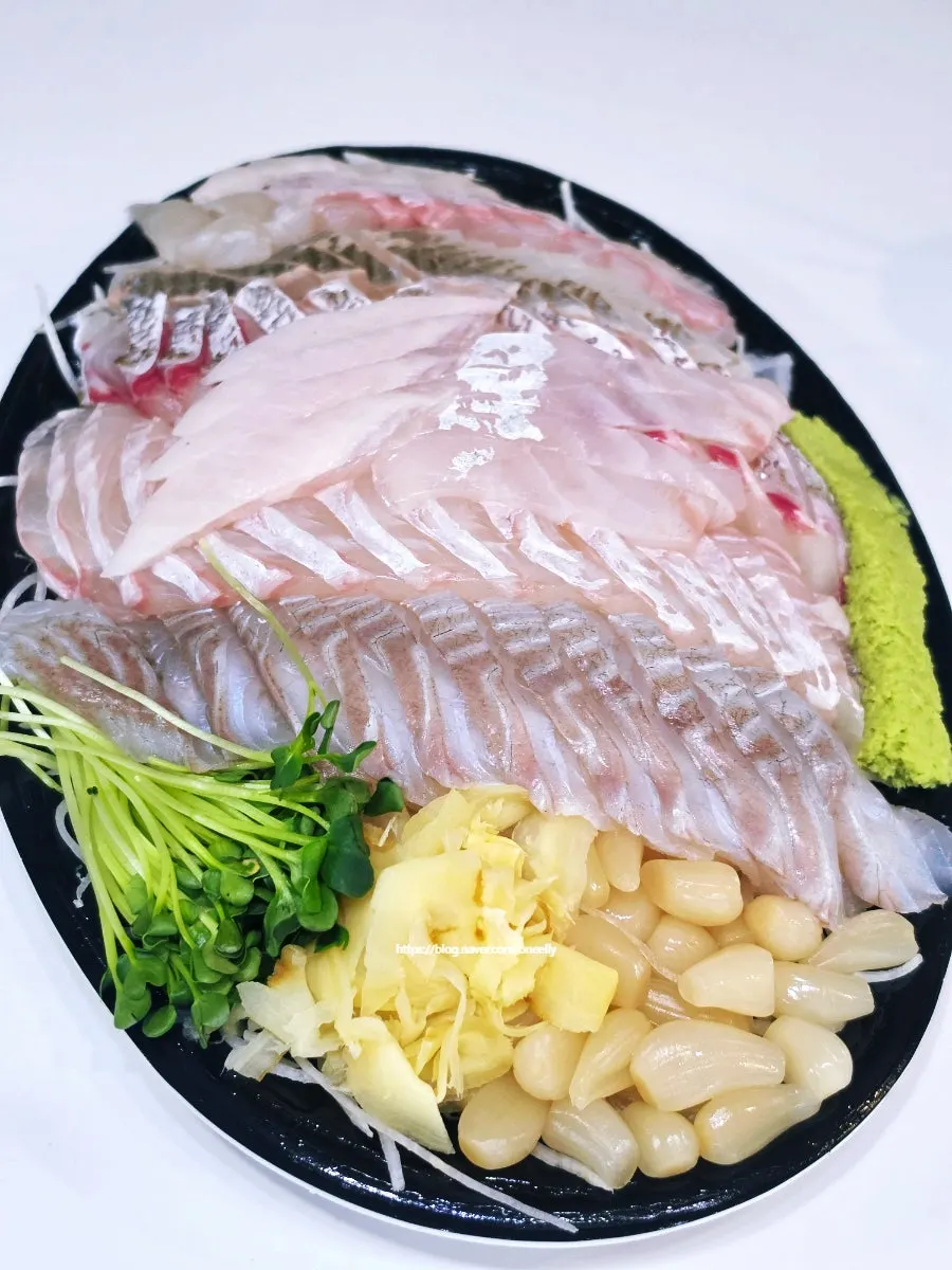 Generous assorted sashimi layered in the box