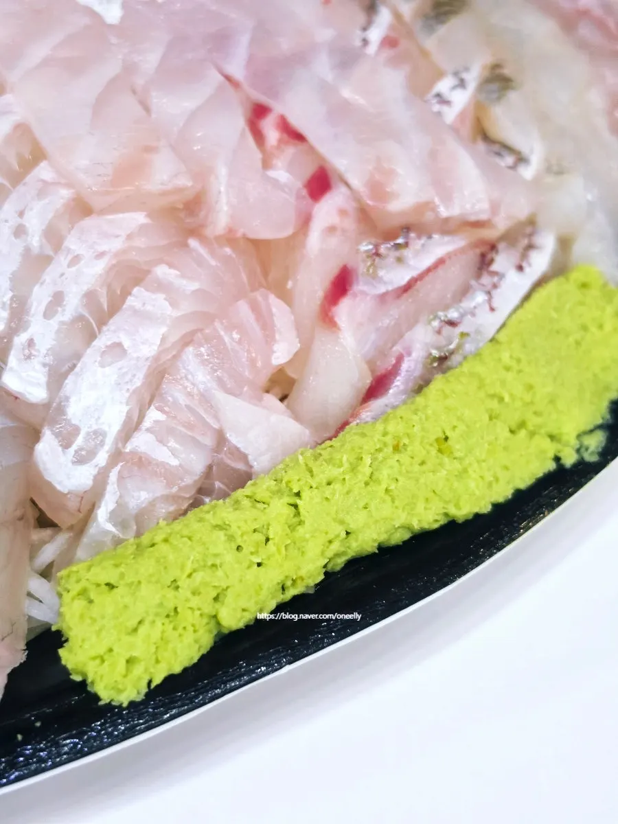 Sashimi with radish sprouts, rakkyo pickles, and ginger