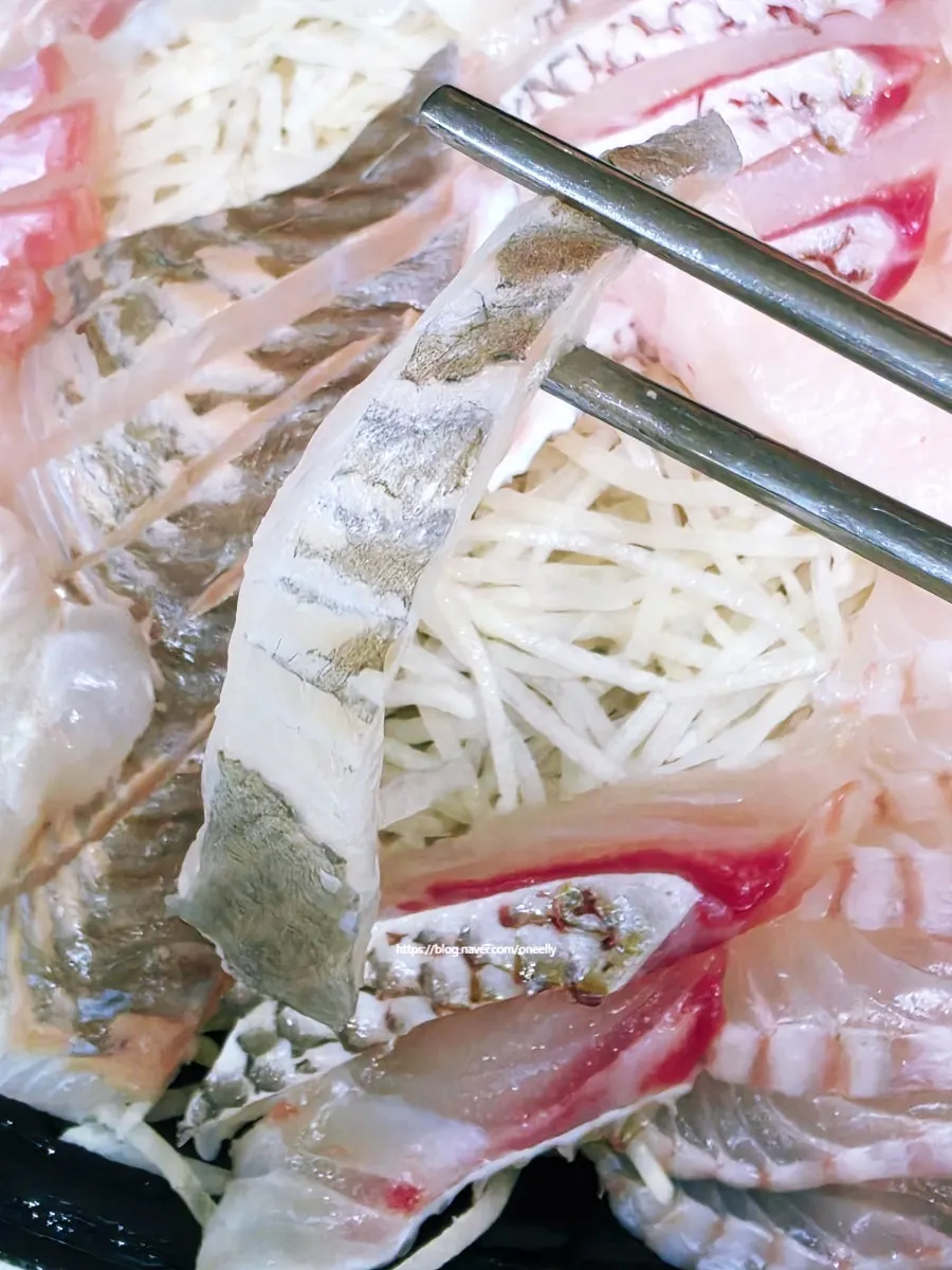 A clear, thick slice of sashimi