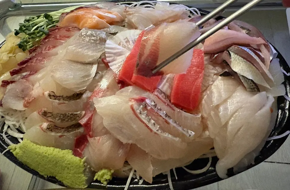 Sashimi plate served with wasabi, pickled radish and ginger