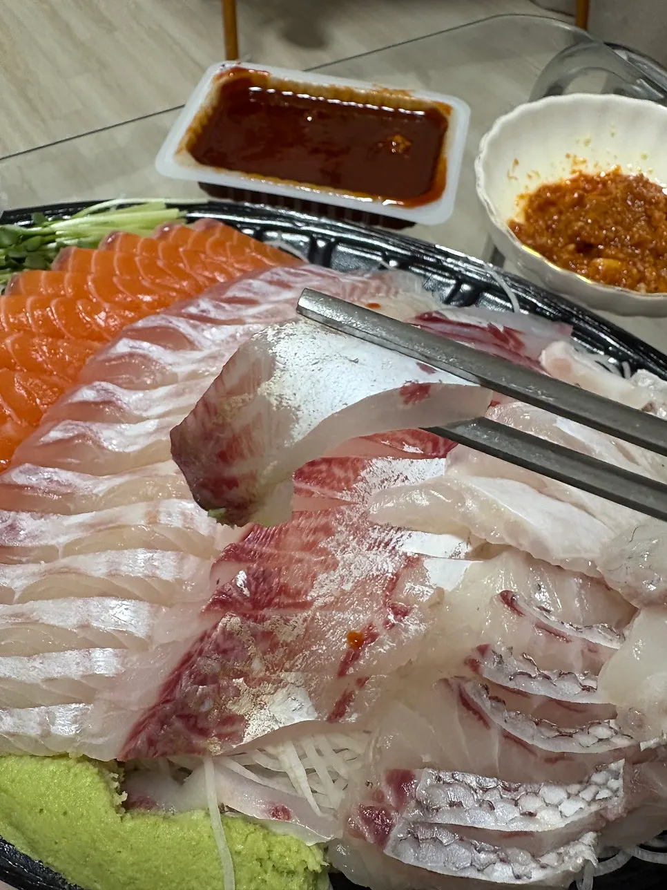 Full assorted sashimi platter with four types of fish