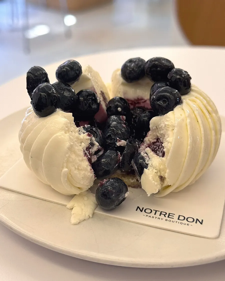 Fork cutting into the mascaberry cream and mousse