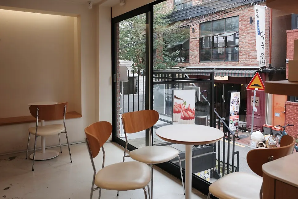 Notldun's interior seating with sunlight pouring through the floor-to-ceiling windows