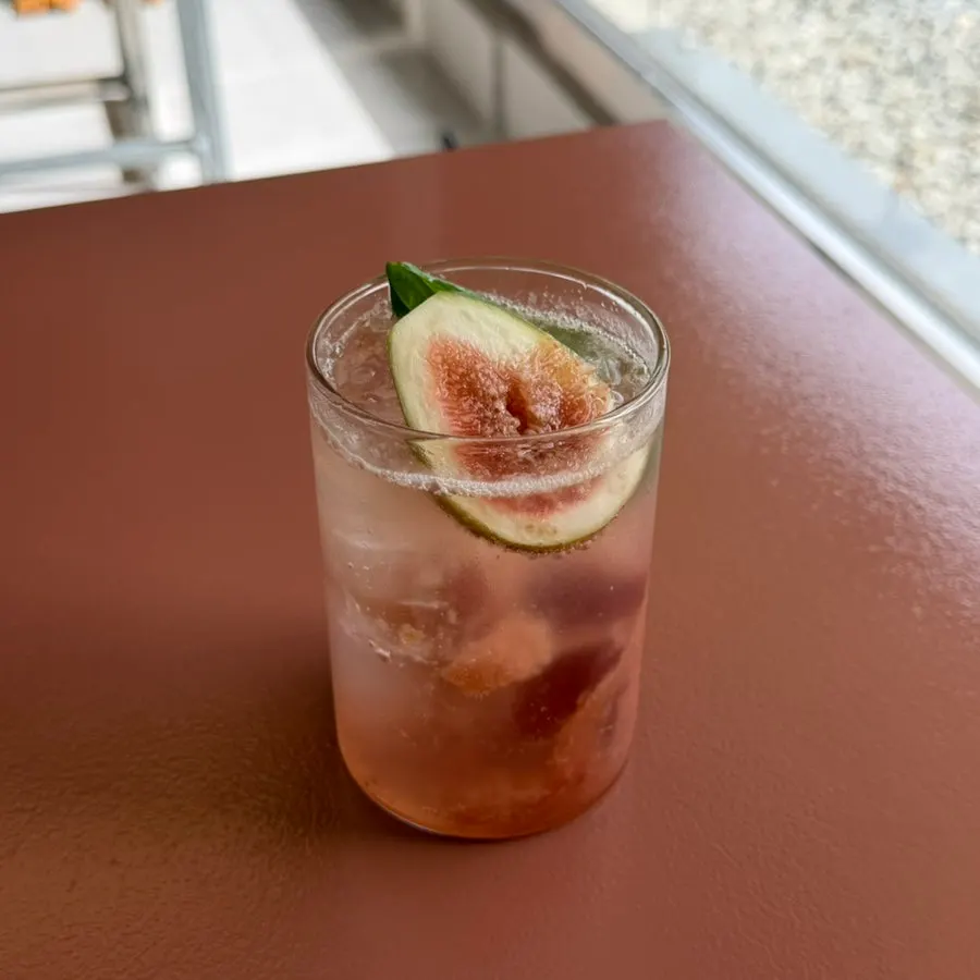 Half a fresh fig sitting on top of the ice
