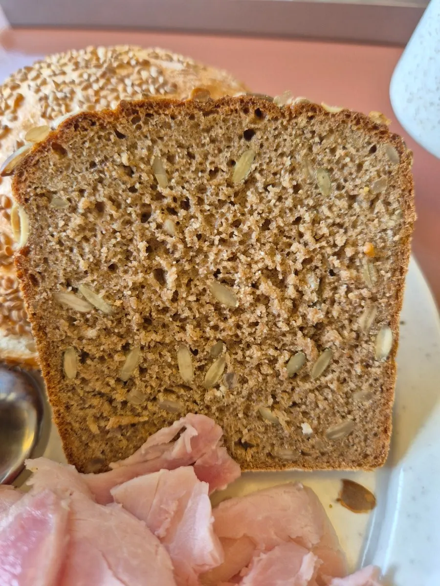 Bread served with hazelnut butter and seasonal peach jam