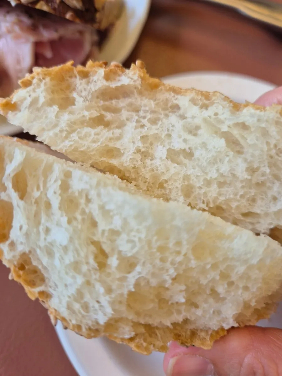 Rye bread topped with jamón and cheese