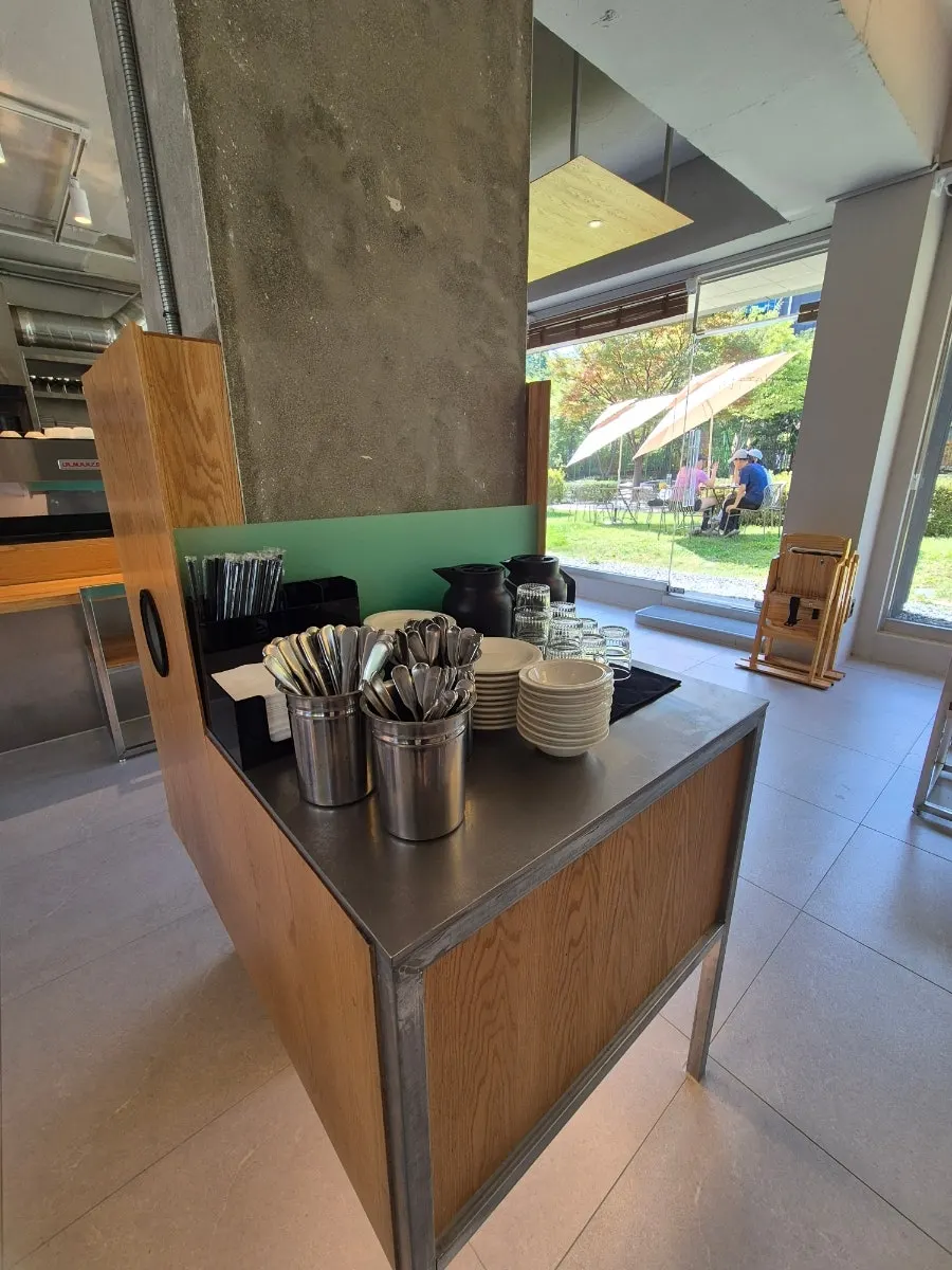 Self-serve bar with plates and cutlery