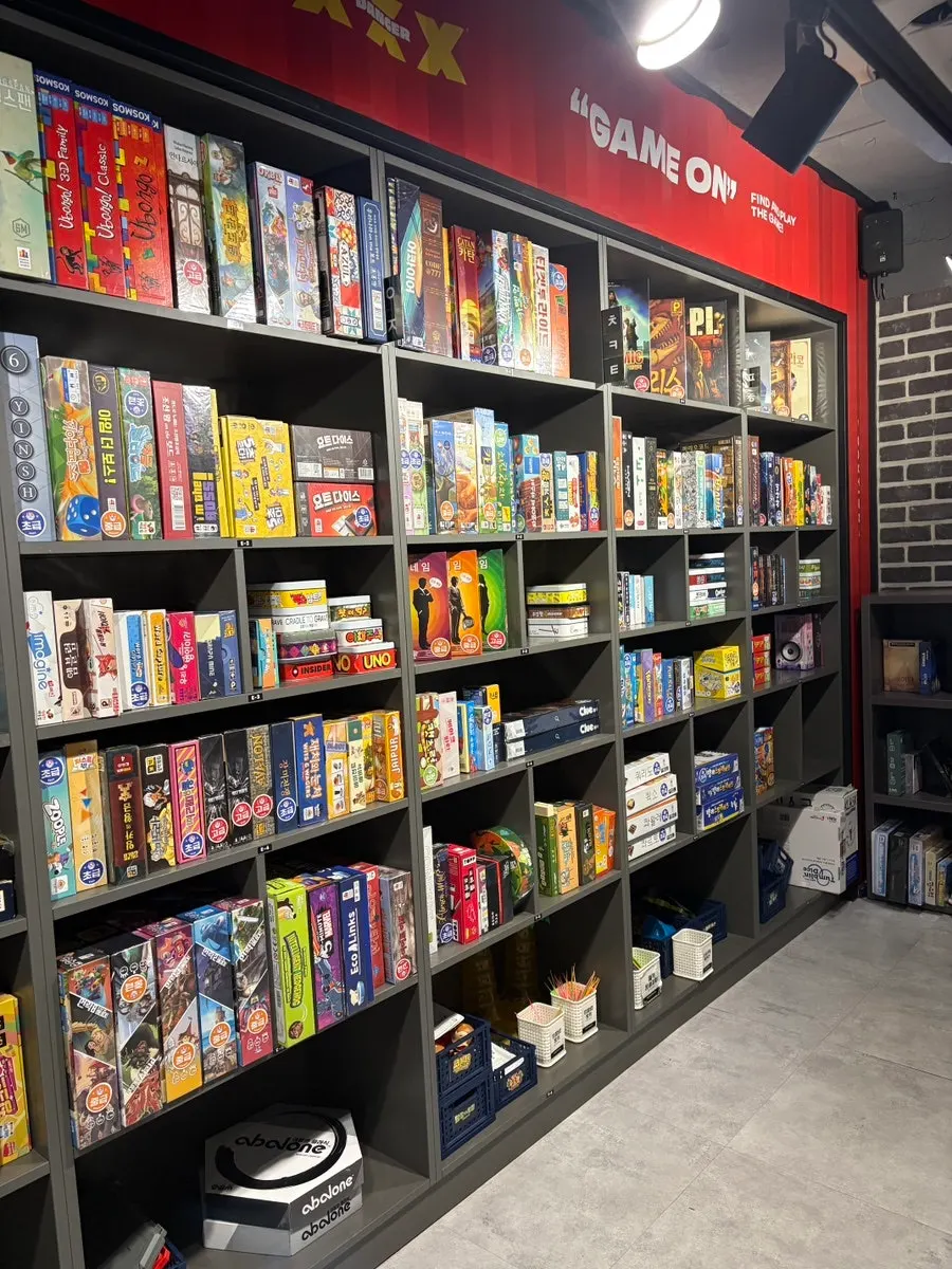 Shelves holding a wide variety of board games