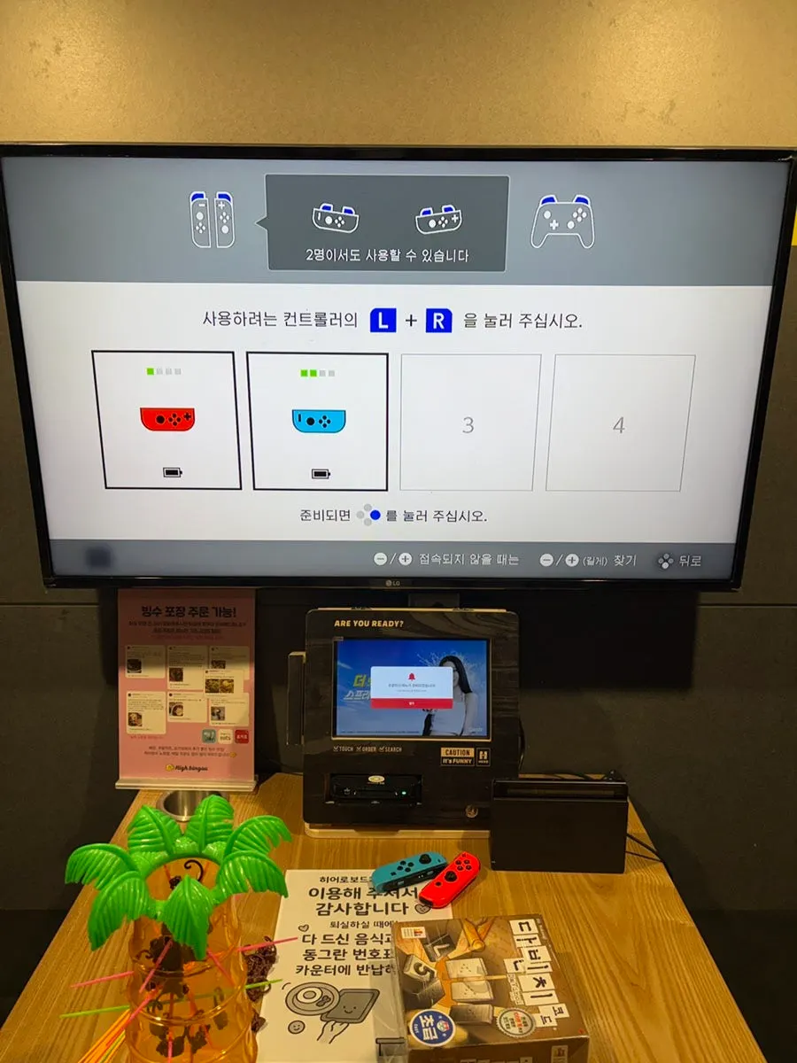 Nintendo console set up in the board game café room