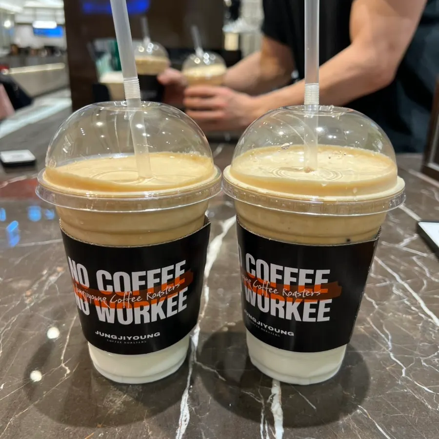 A cup of coconut coffee with visible layers