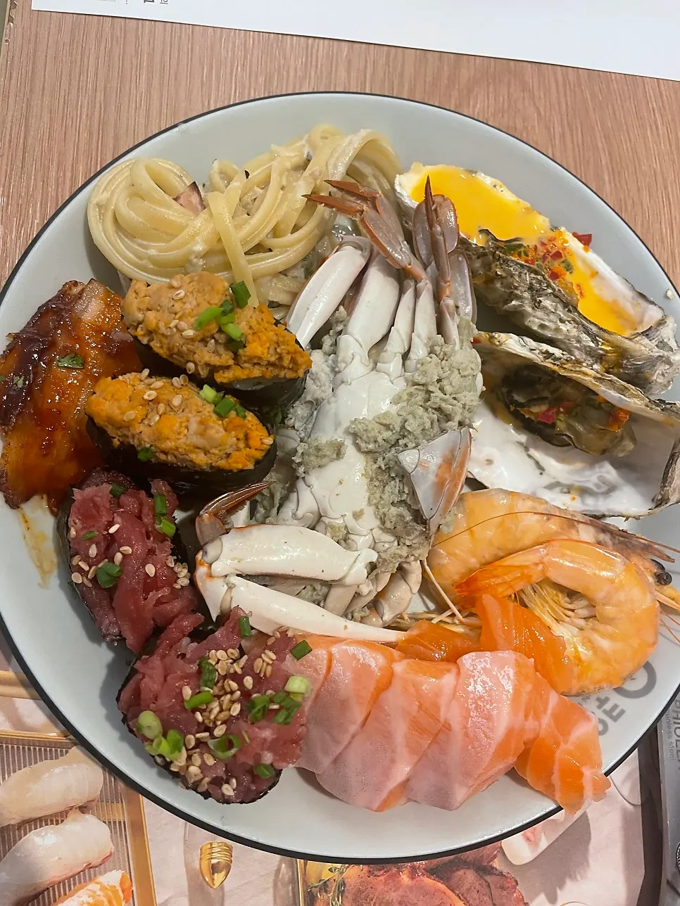 A plate loaded mostly with seafood