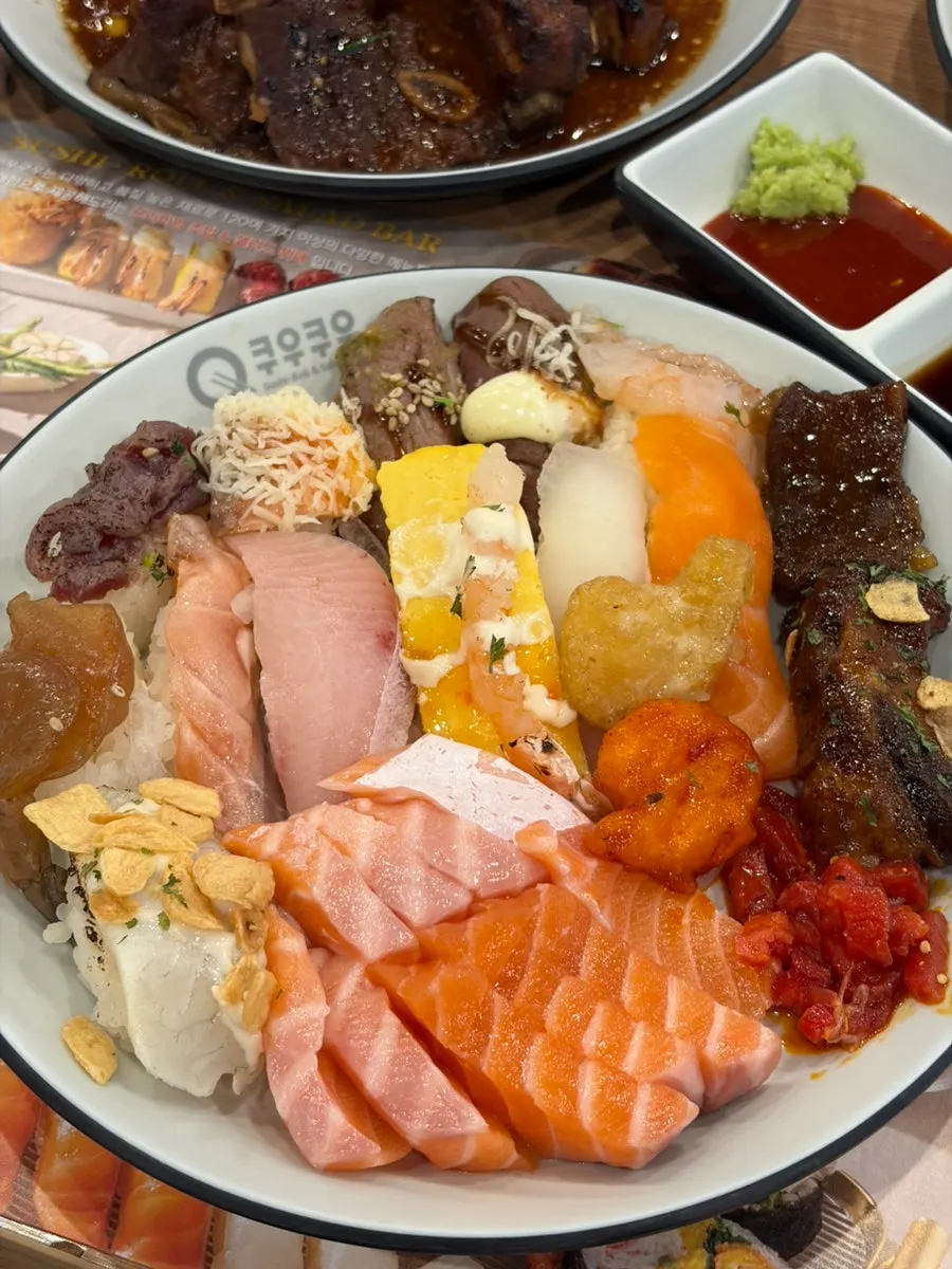 First plate of sushi, sashimi, and meats