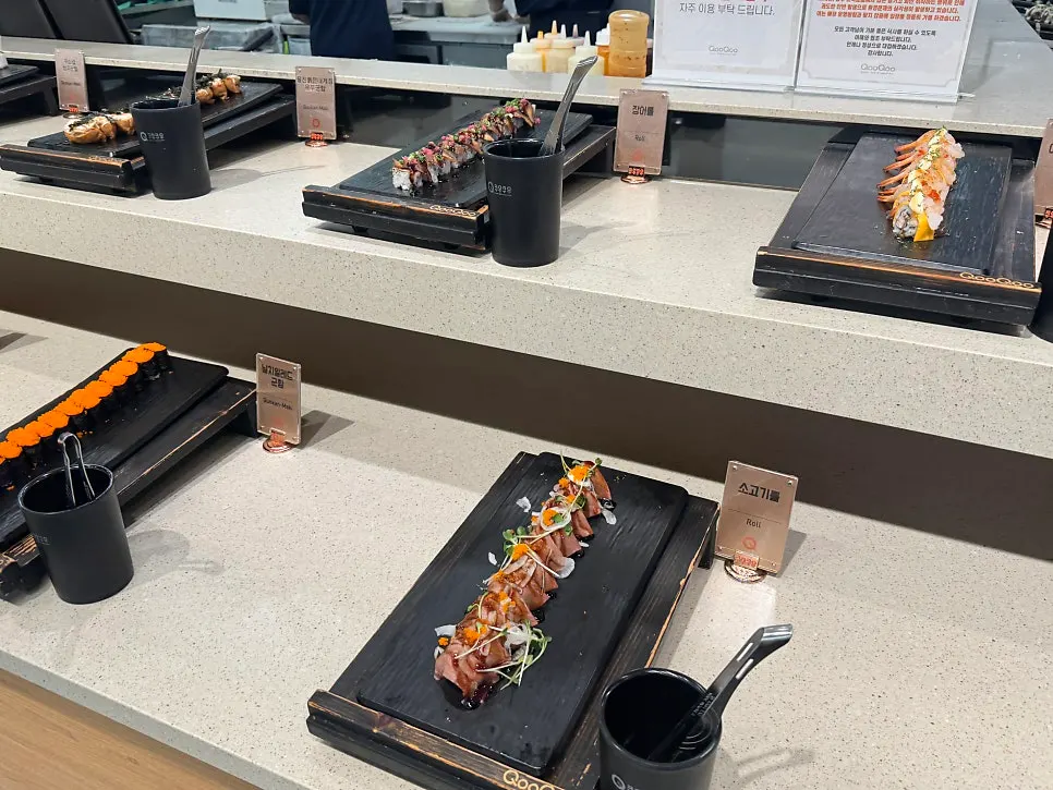 Rolls and sushi laid out on the buffet counter