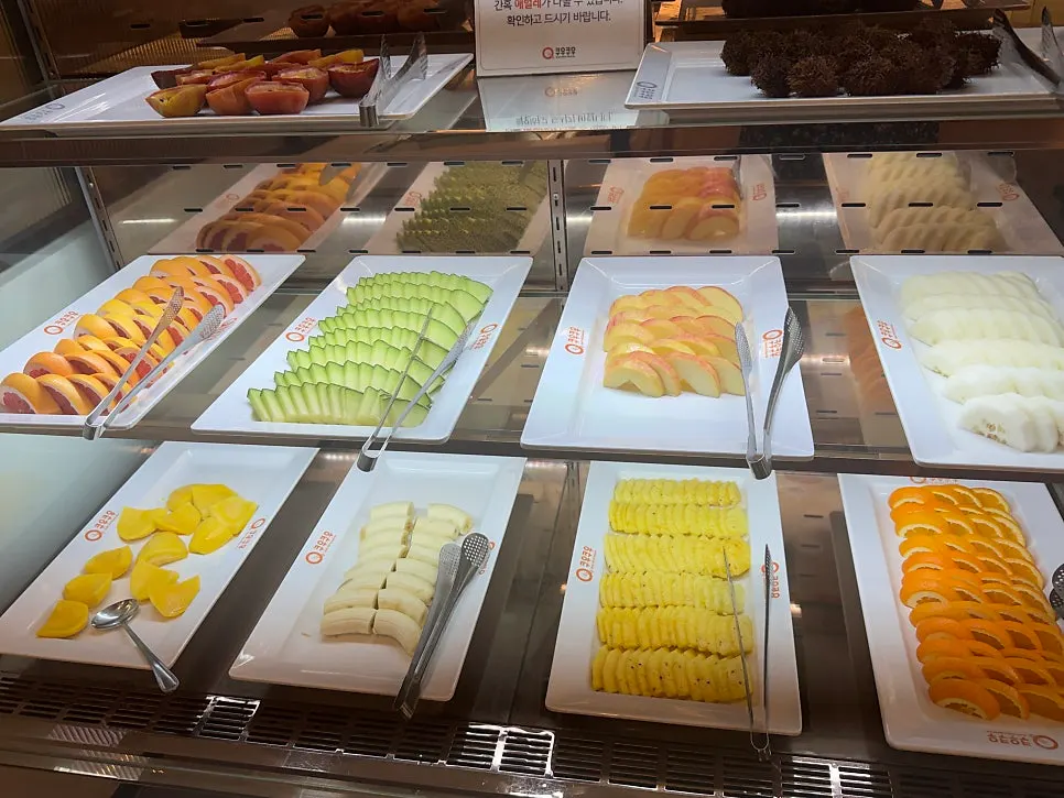 A buffet plate loaded with sushi and rolls