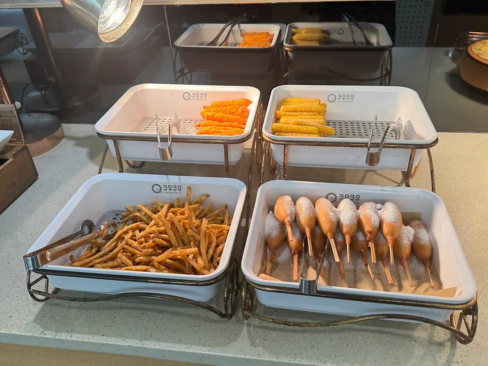 Chili shrimp, chicken and other hot food items on display