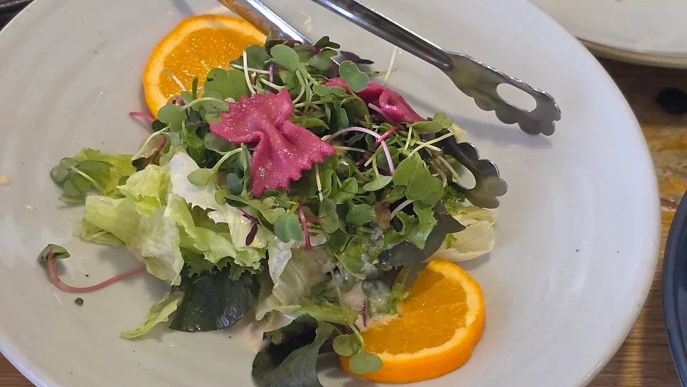 Salad topped with a bright dressing