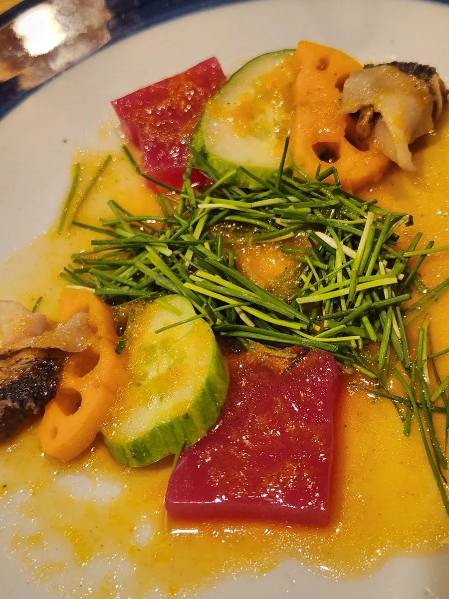 Yulmu barley and cherry blossom porridge with orange butterfly salad
