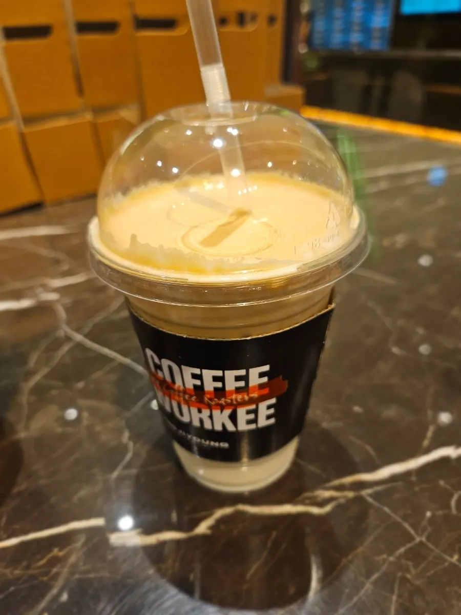 Signature coconut coffee topped with soft foam
