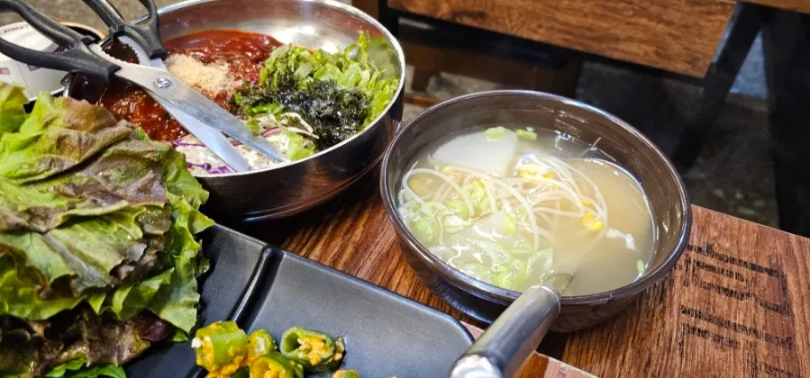Table spread with bibim makguksu and jokbal