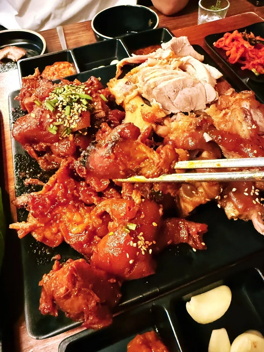 Close-up of fire jokbal coated in spicy sauce