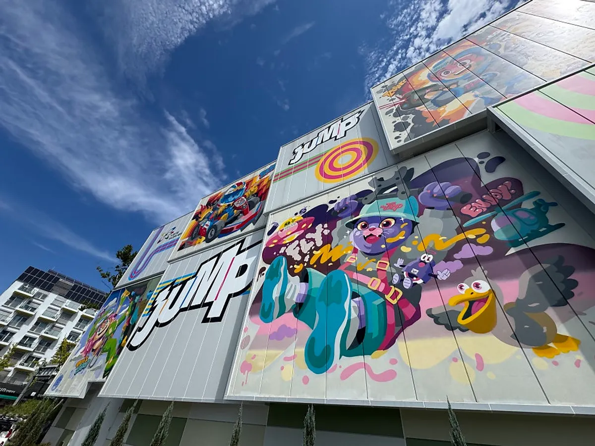 Indoor theme park entrance with Jump operating-hours information