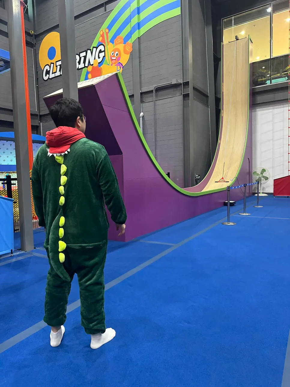 Indoor slide used while wearing activity clothing