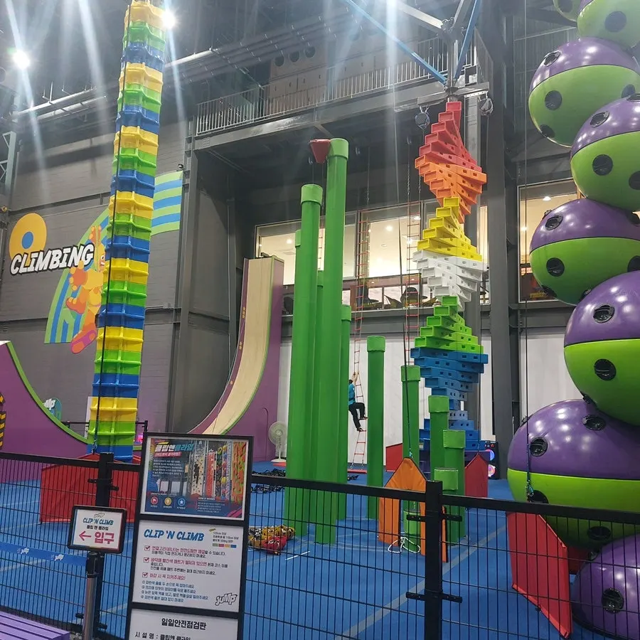 Activity space with drink holders next to the high-rope course