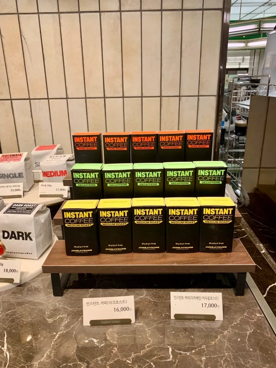 Shelf of dark roast beans for sale