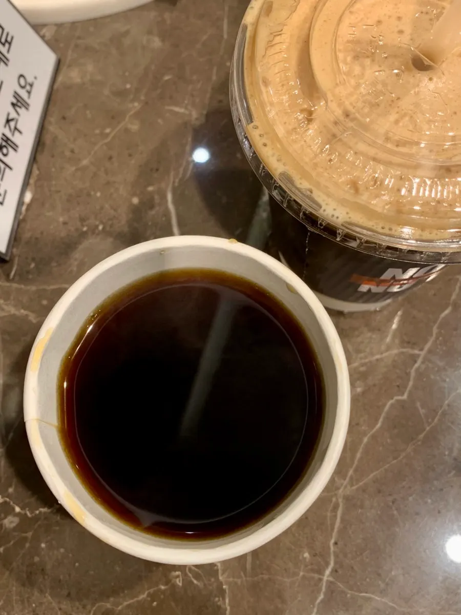 Drip coffee cup with the lid opened