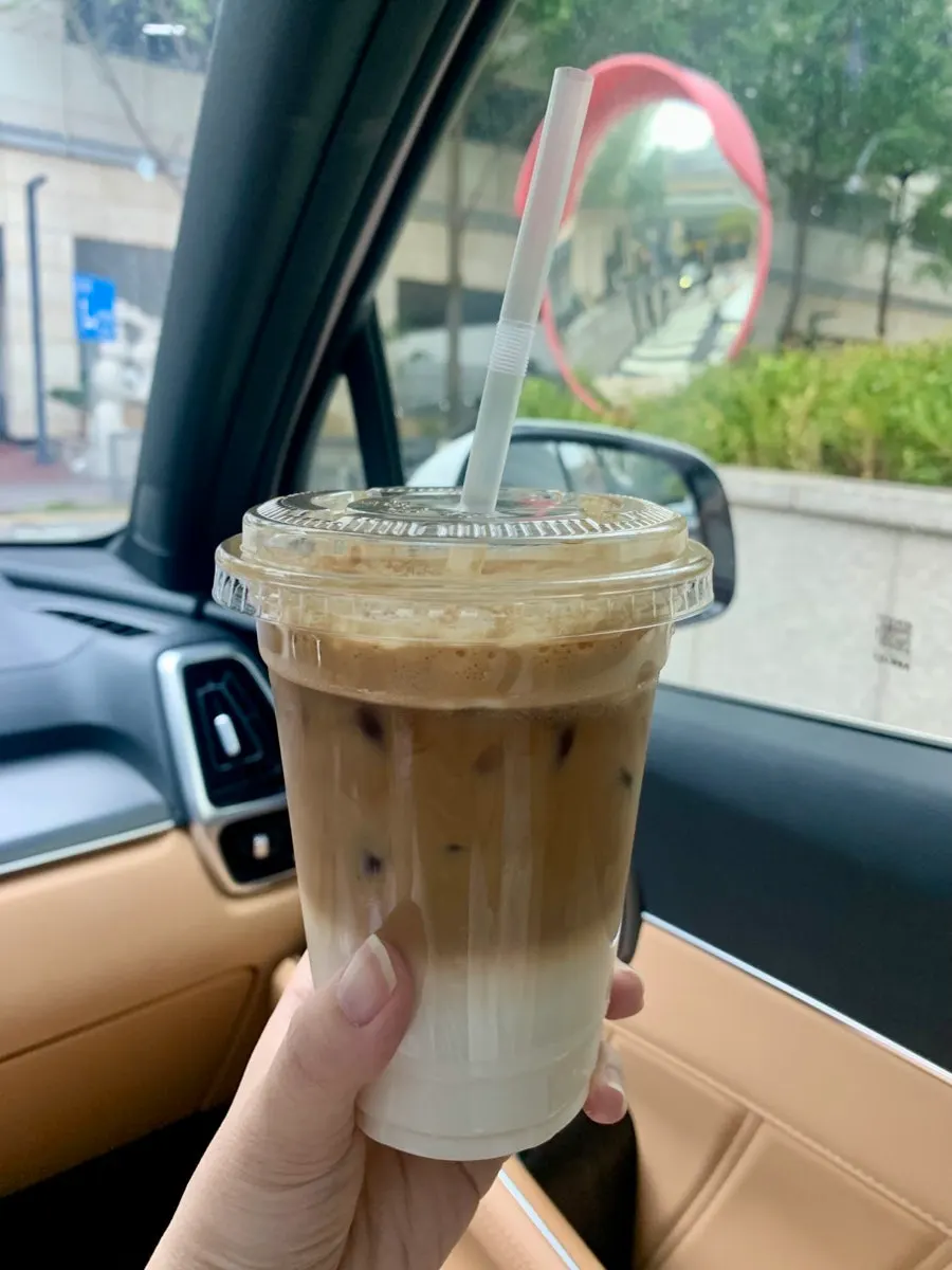 Coconut coffee with layered coconut milk and shaking espresso
