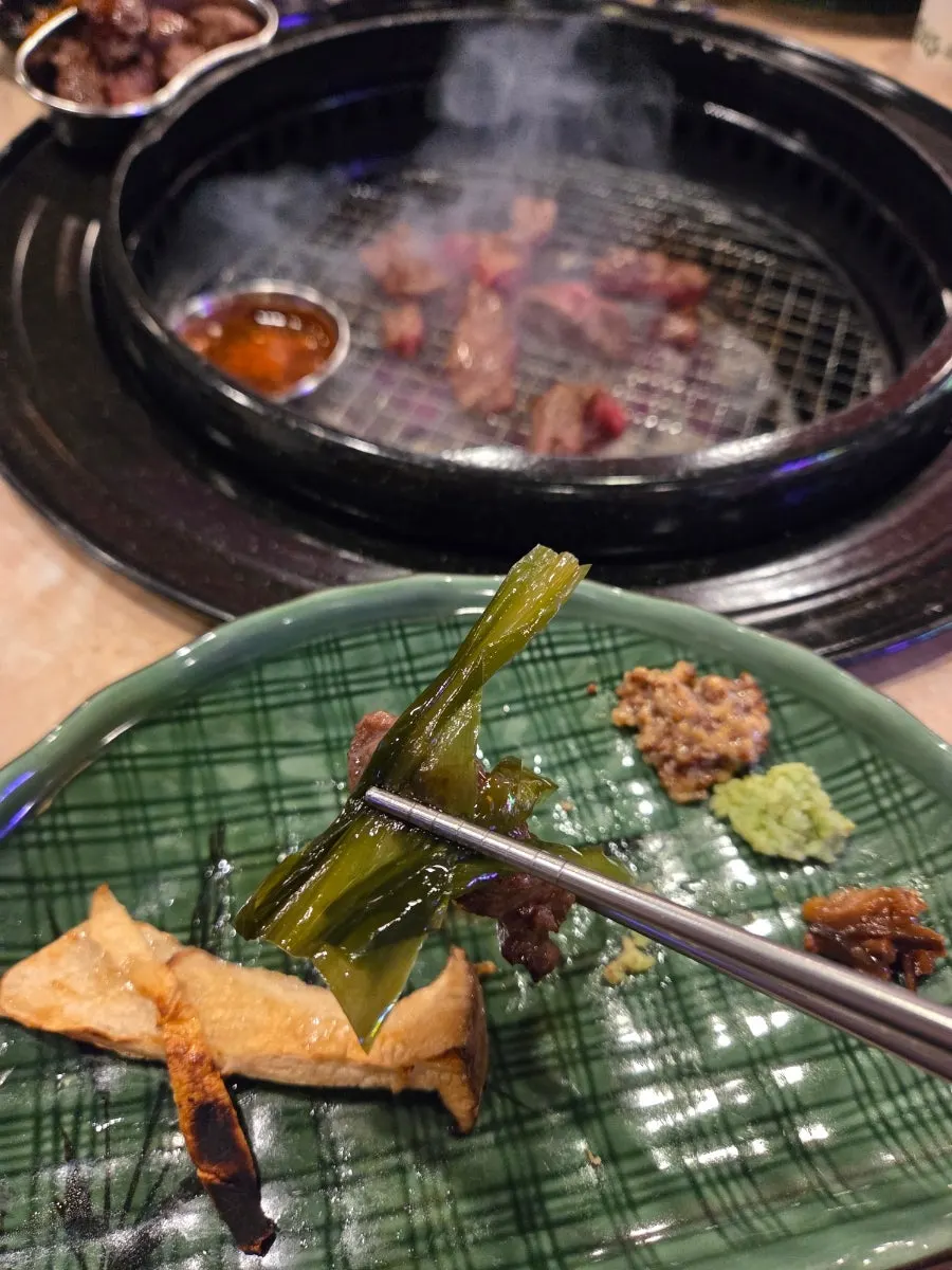 Thick Iberico kkotmoksal placed on the grill