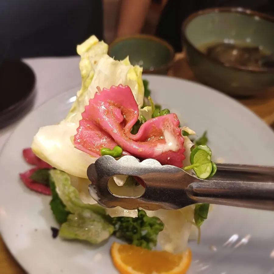 Wild greens salad with orange sauce