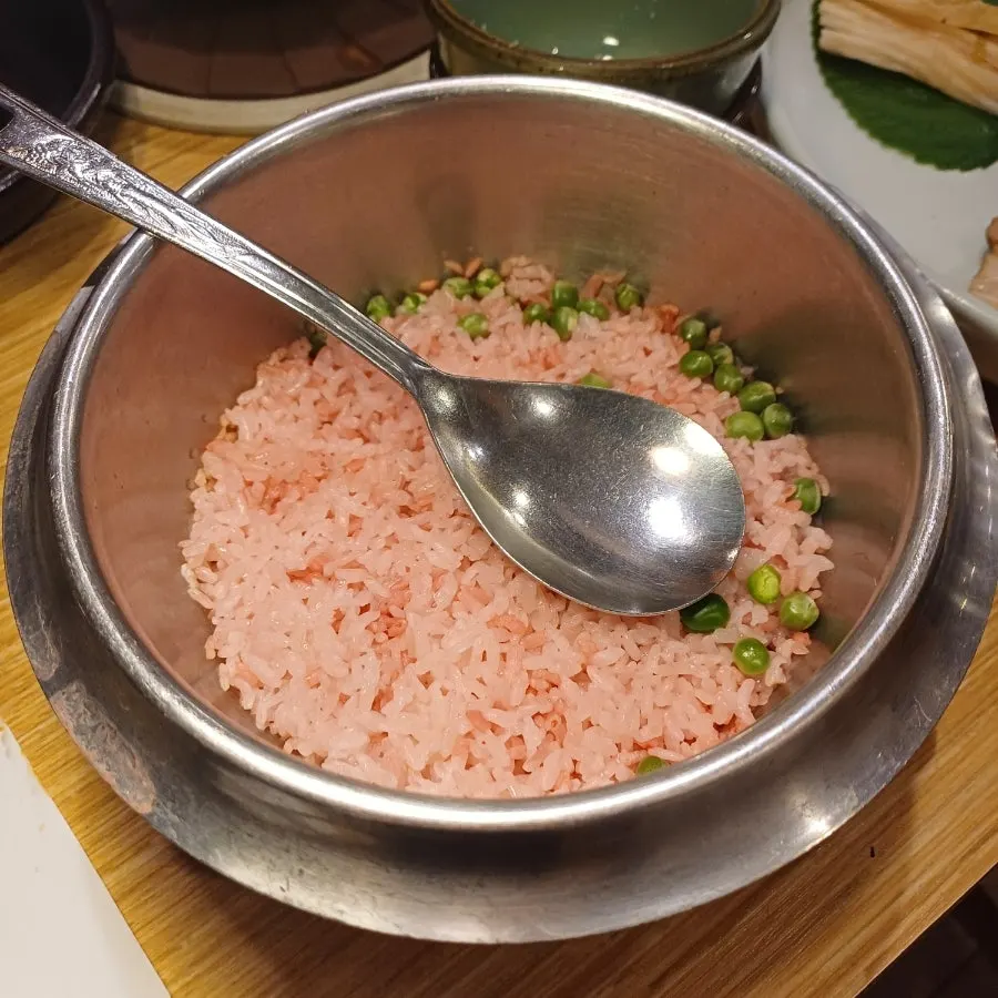 Pink cherry-blossom rice hotpot made with red yeast rice