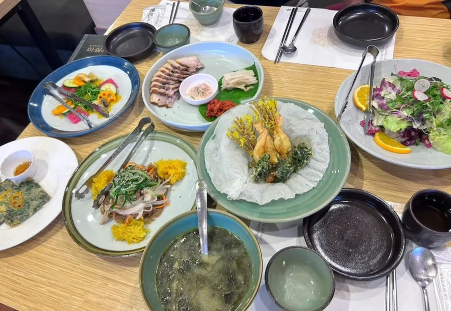 A carefully plated hanjeongsik table spread