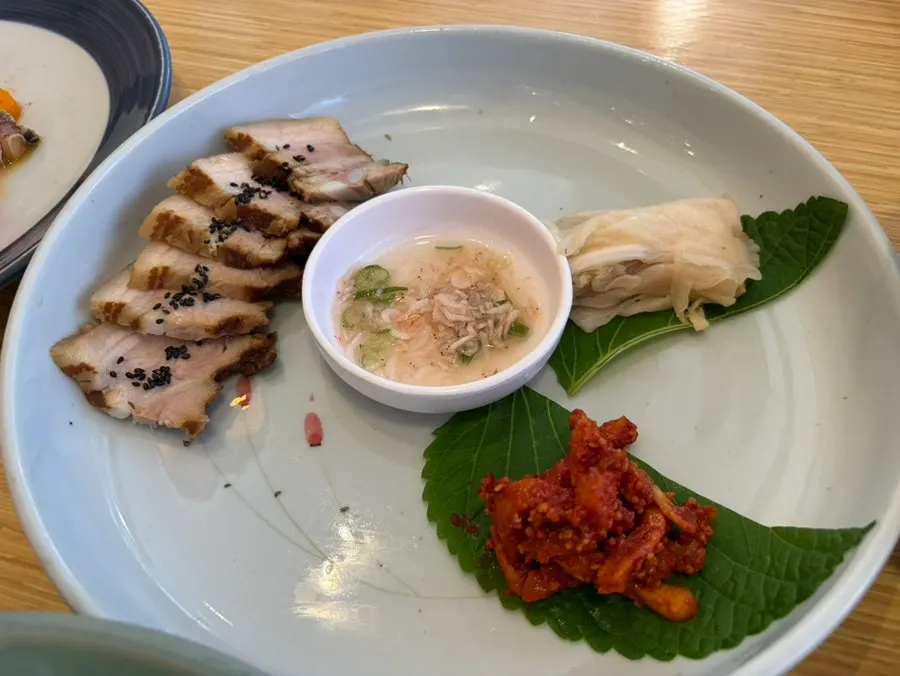 Dallae batnabi japchae topped with various garnishes