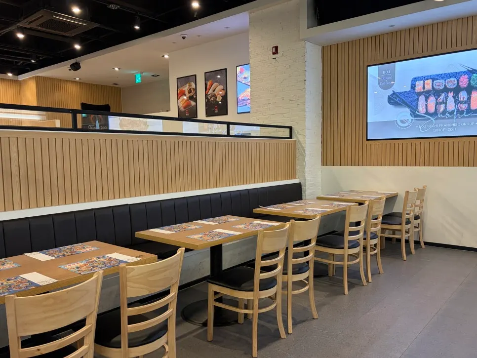 Spacious dining hall interior in natural wood and white tones