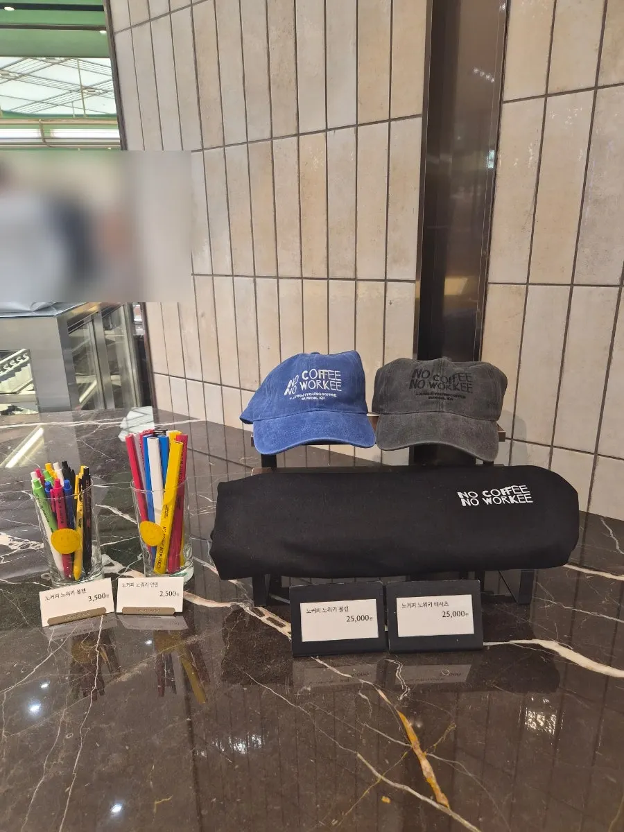 Display of lifestyle MD goods including hats and pouches