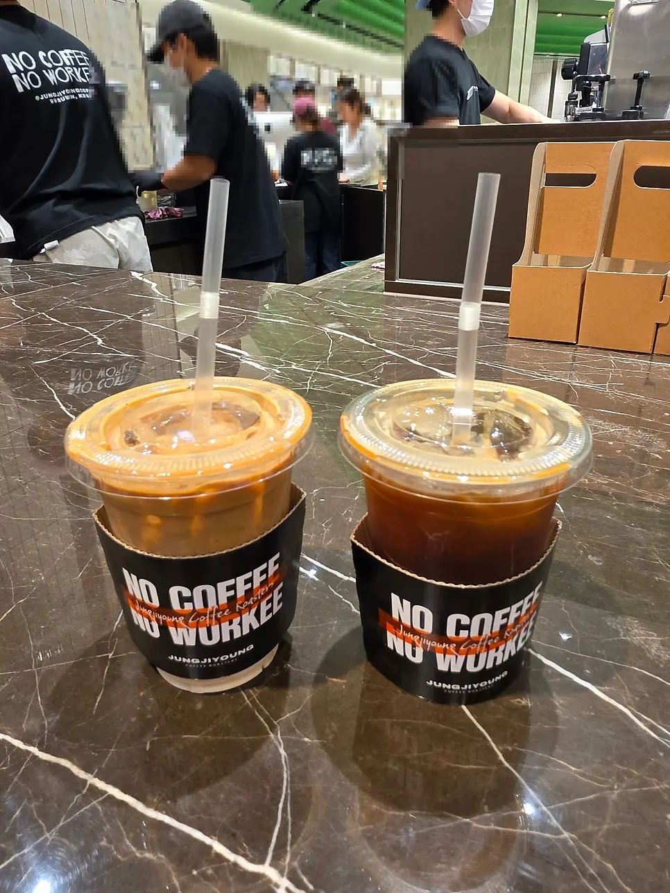 Two finished iced coffees on the table