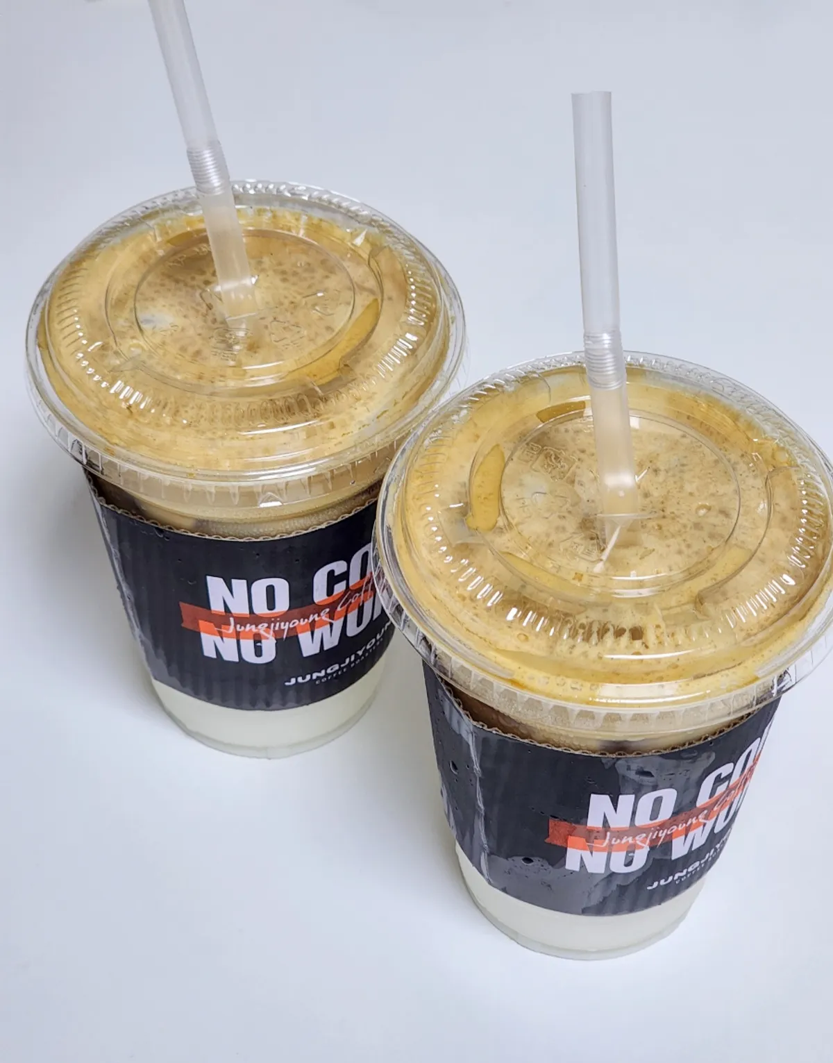 Two cups of signature coconut coffee to go