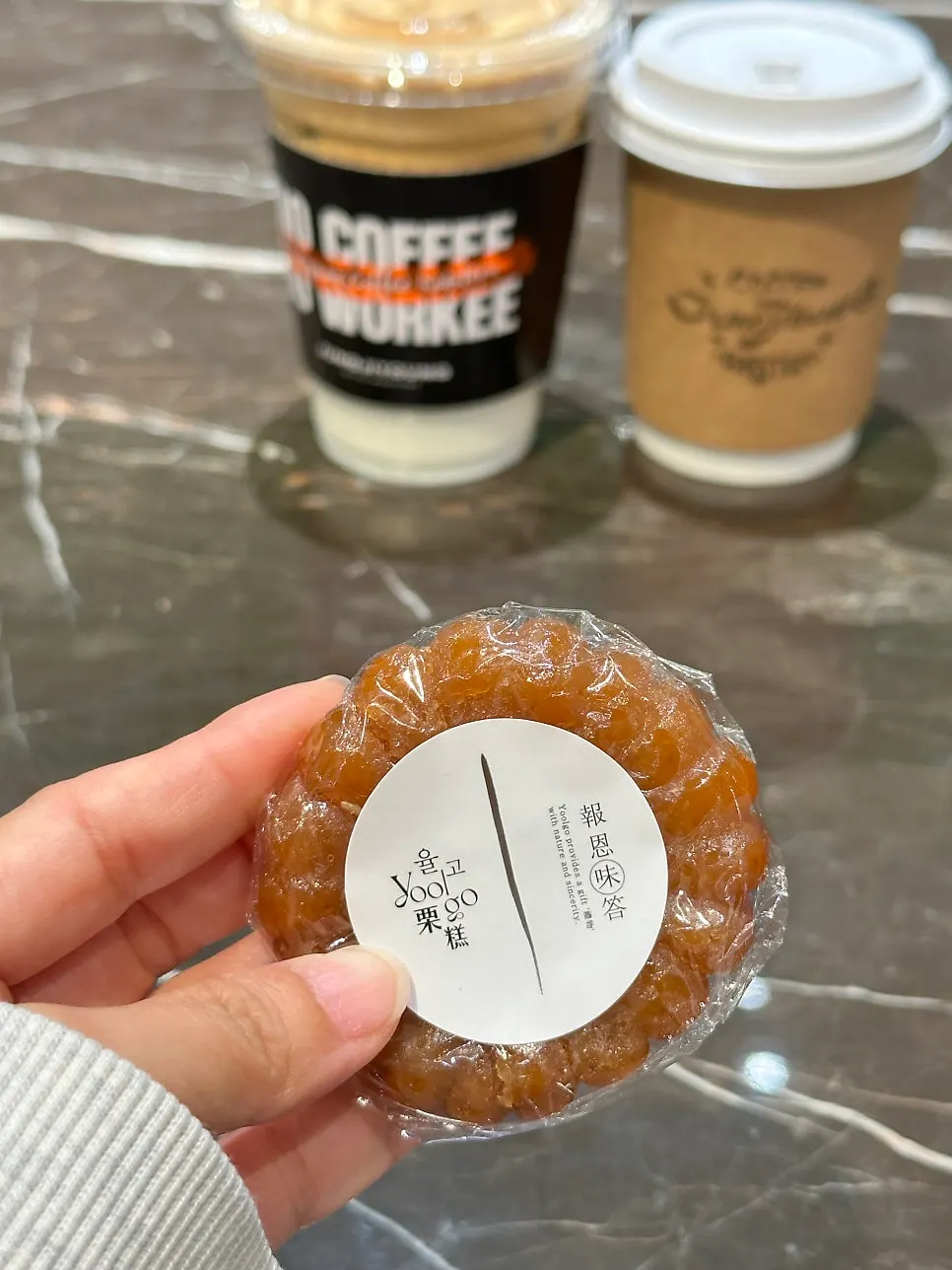 A piece of yakgwa eaten alongside the coffee