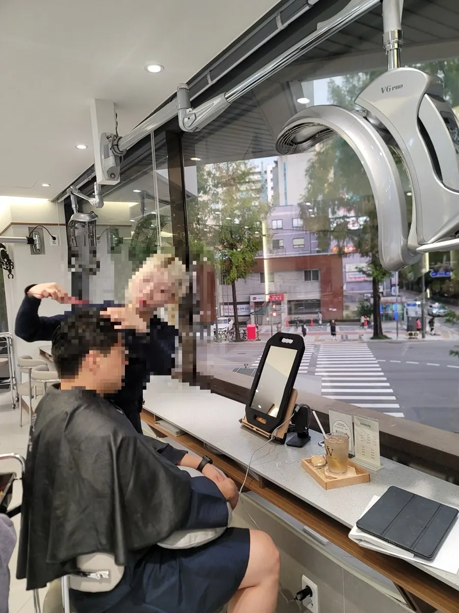 First consultation examining head shape and hair texture
