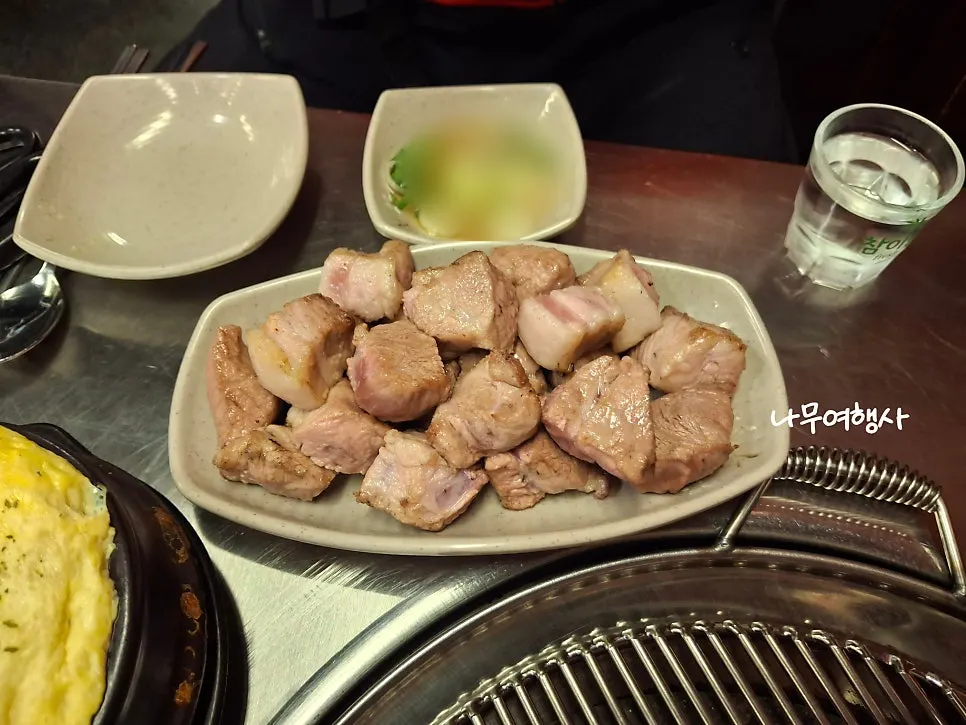 Pre-seared pork neck served at the table