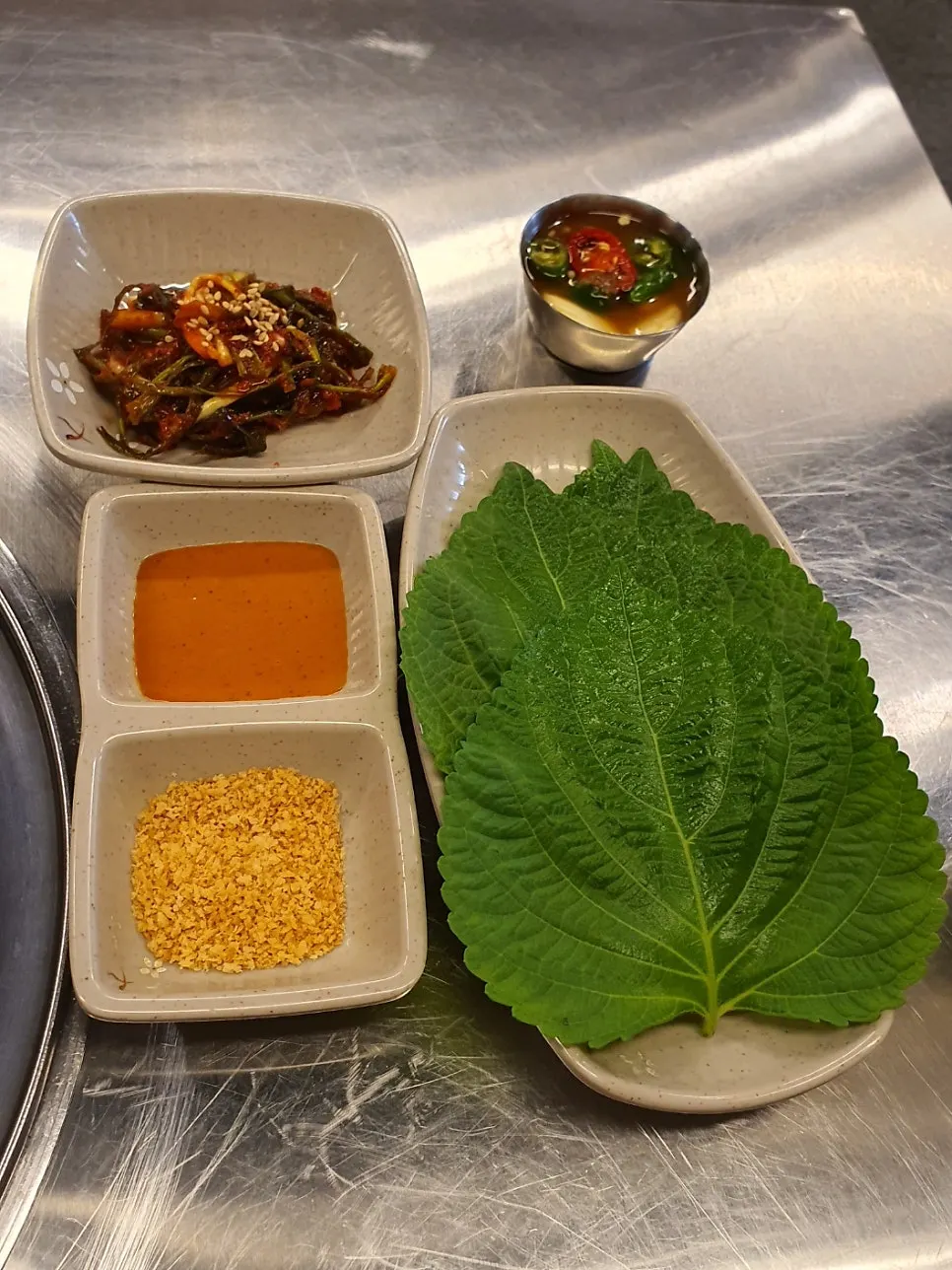 Basic side dishes including myeong-i namul at Moksam Hwaro