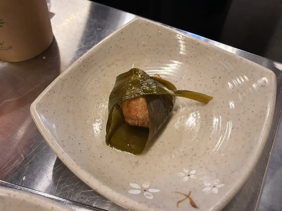 First bite of pork neck dipped in Maldon salt
